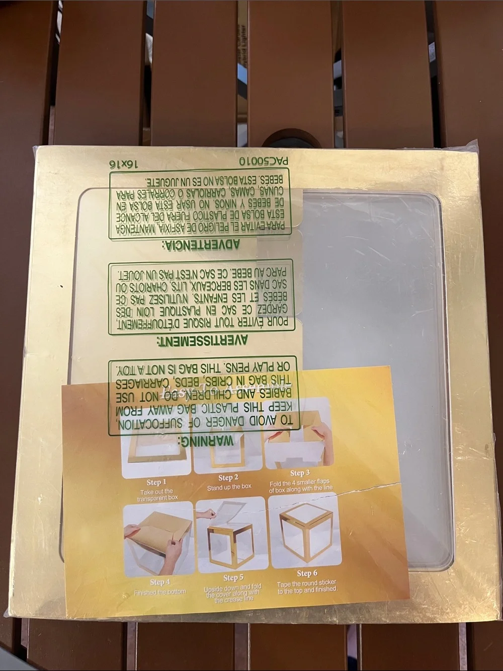 Amazon Gold Gift Box with Clear Window and gold letters that spell out BABY
